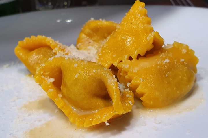 a plate of food with a slice of orange