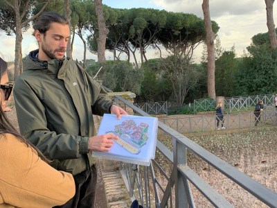 a person standing in front of a fence