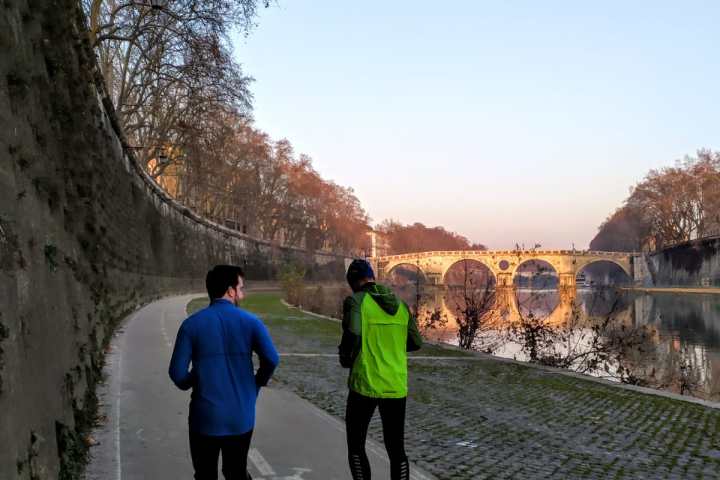 a group of people walking on a sidewalk