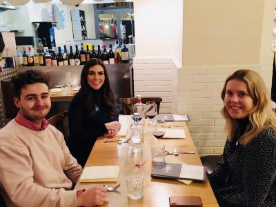 a group of people sitting at a table