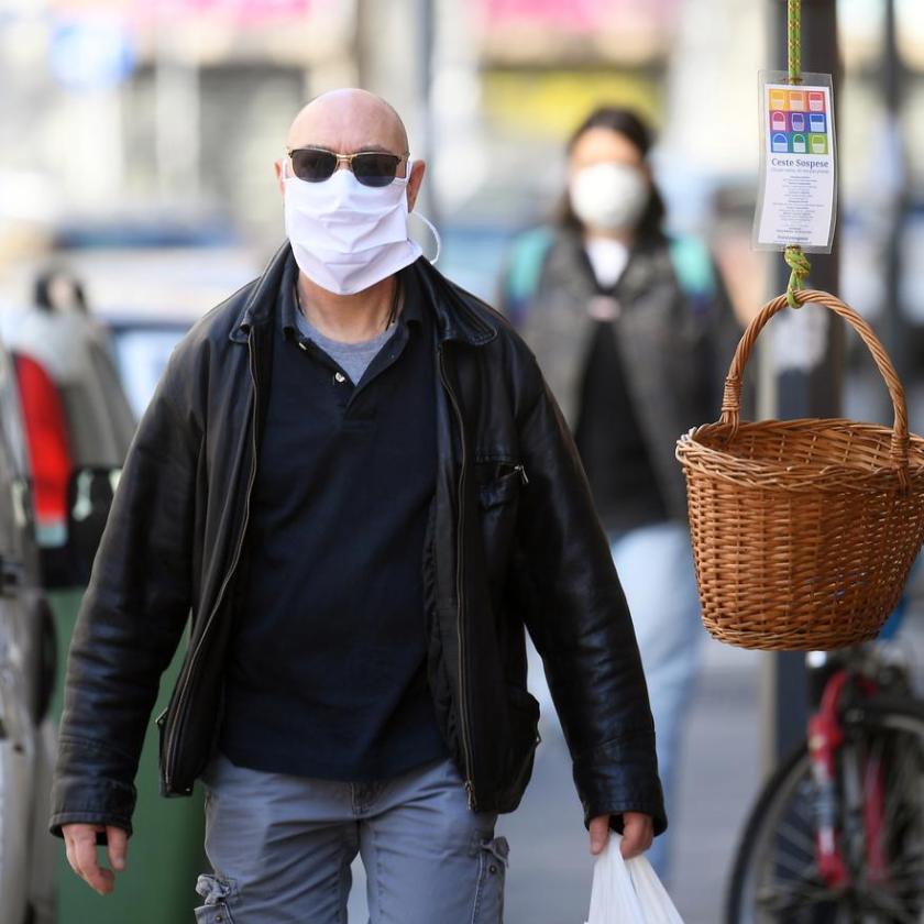 a person standing in front of a bicycle