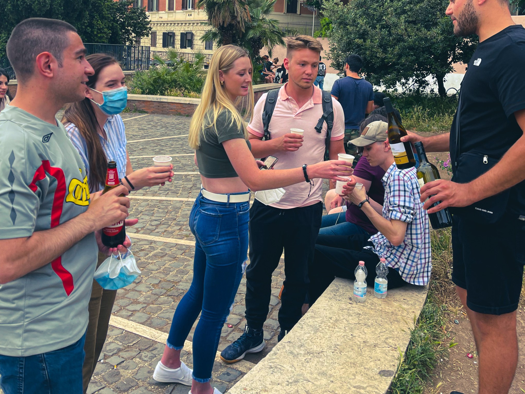 a group of people standing in a park