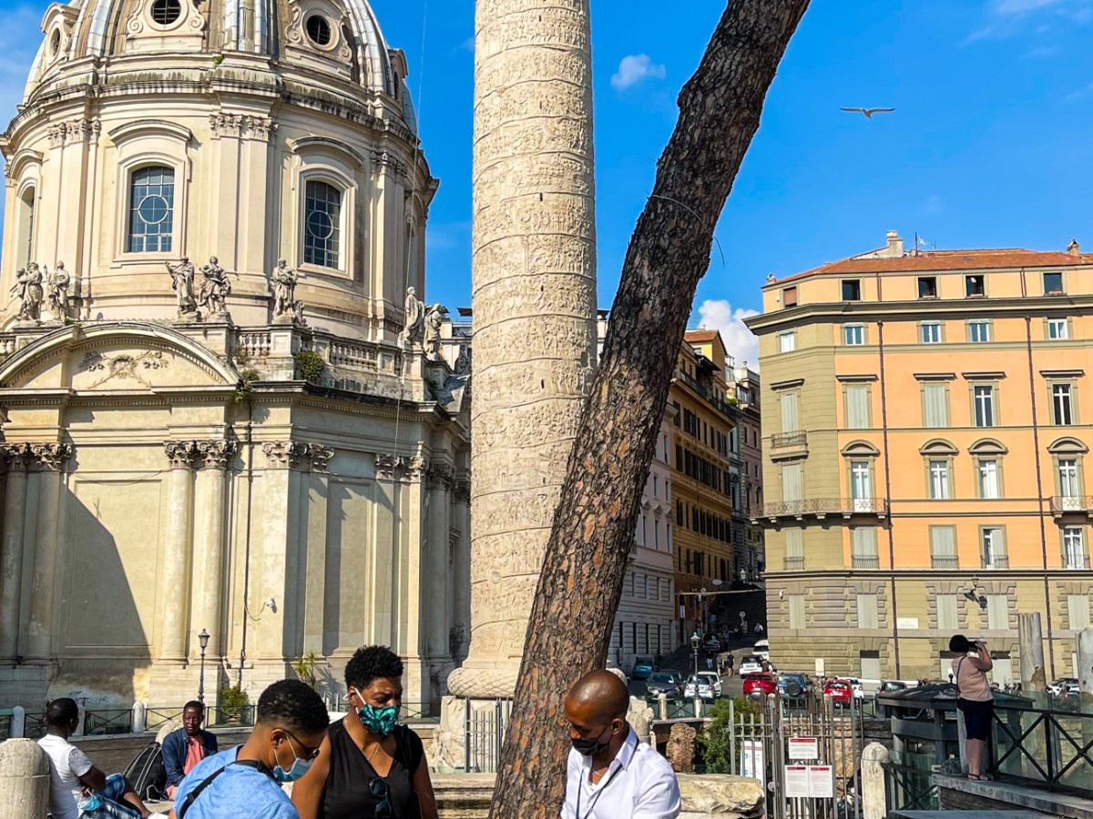 a group of people standing in front of a building