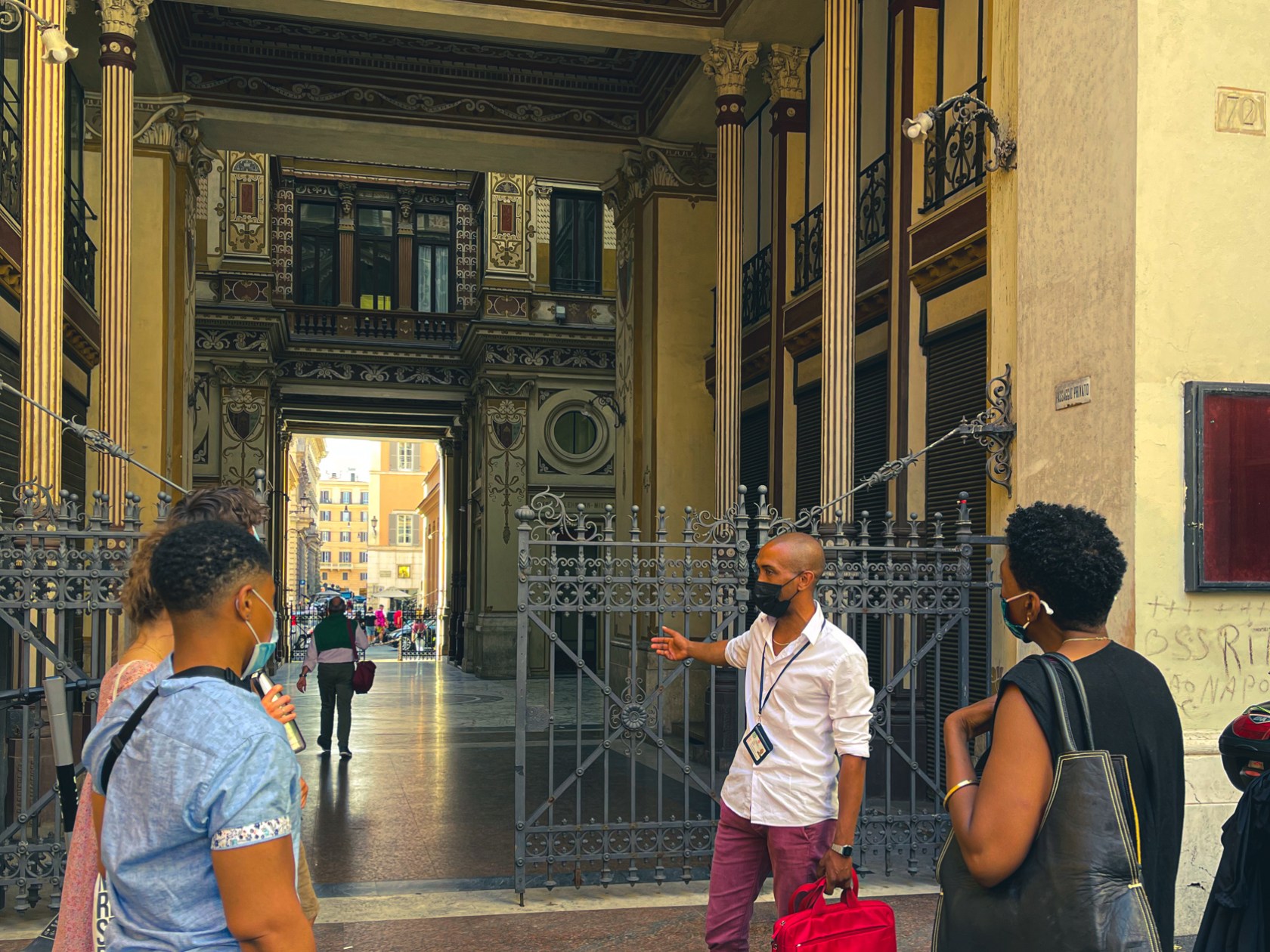 a group of people standing in front of a building