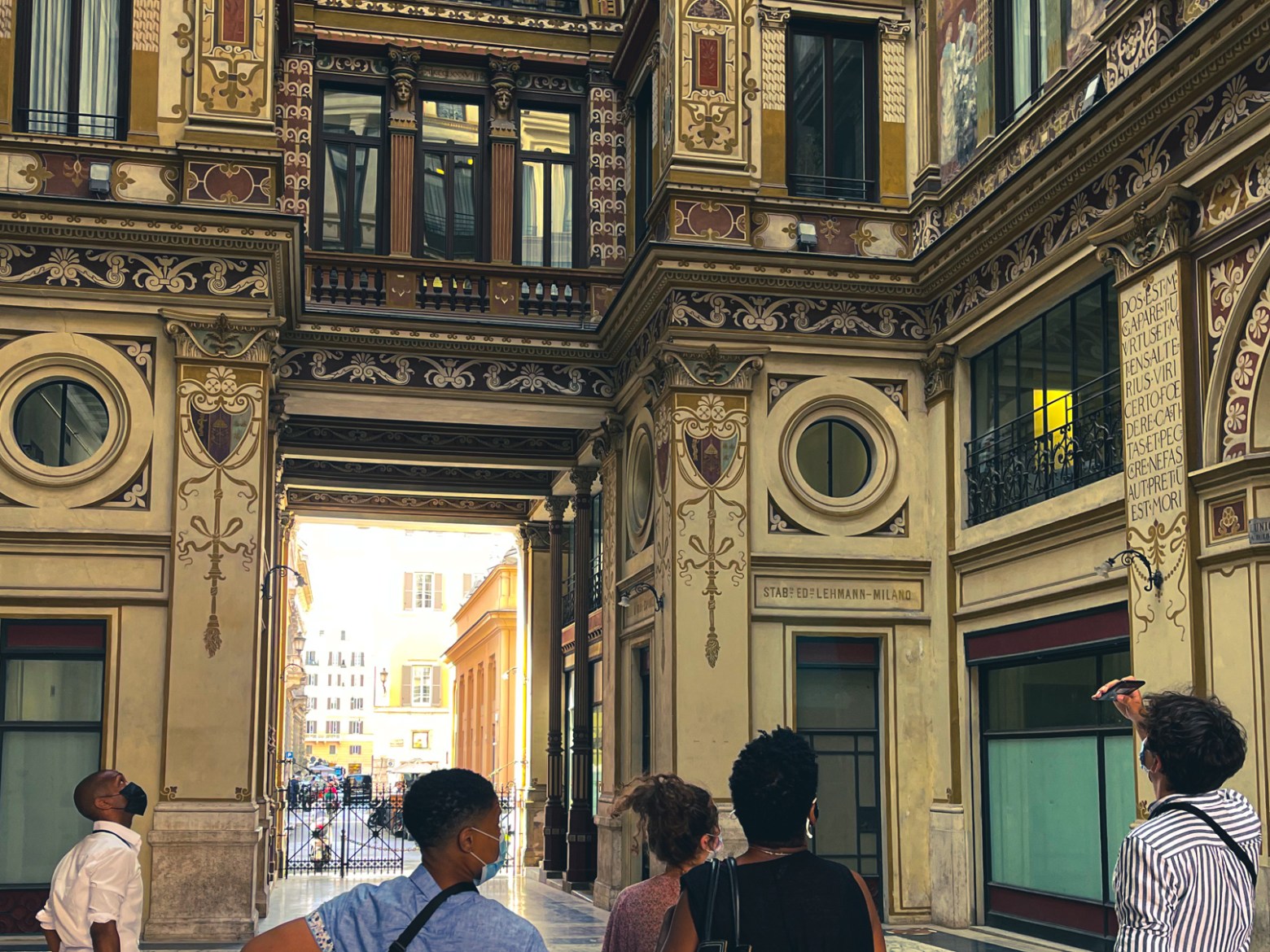 a group of people standing in front of a building