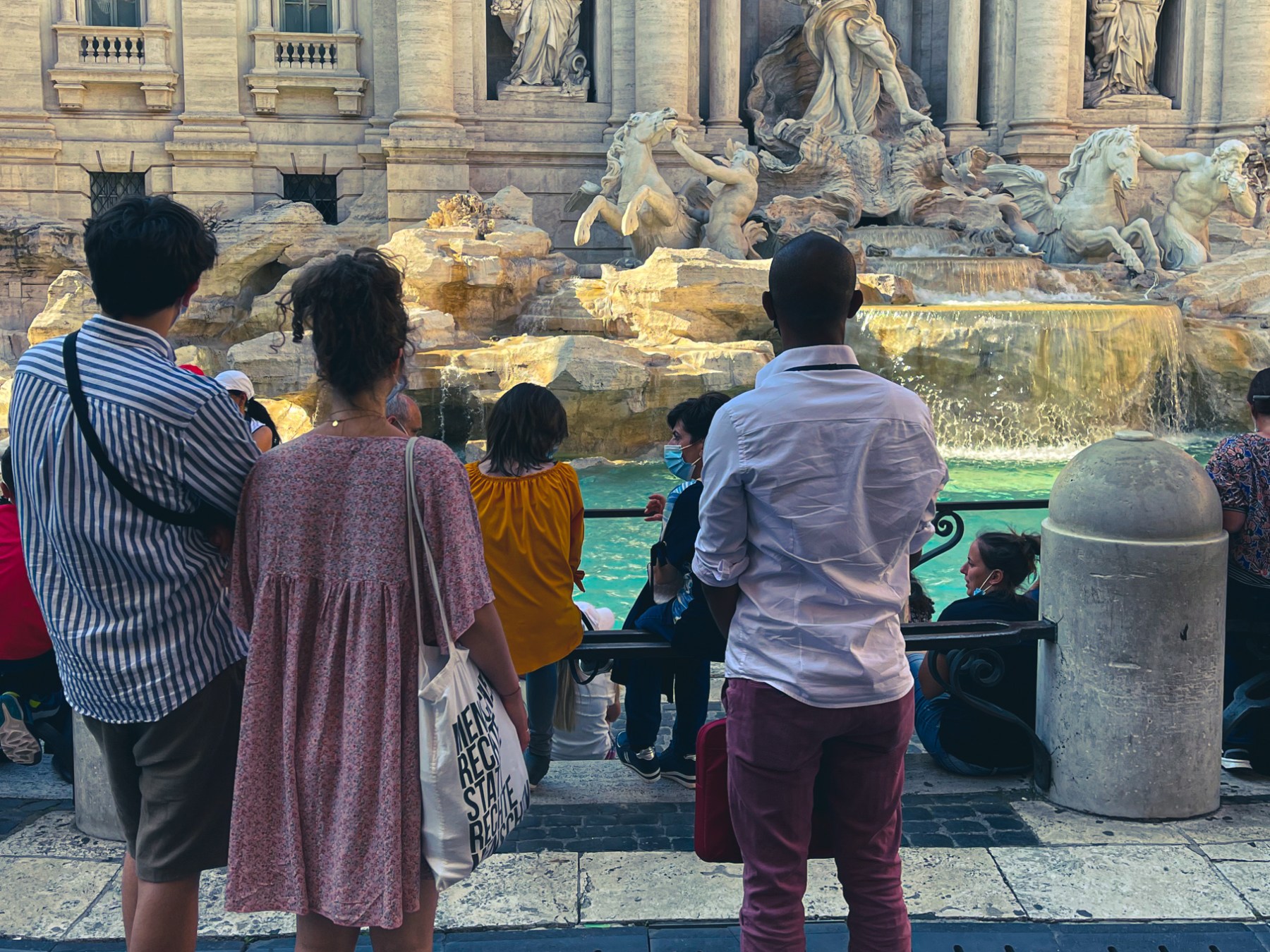 a group of people standing in front of a building