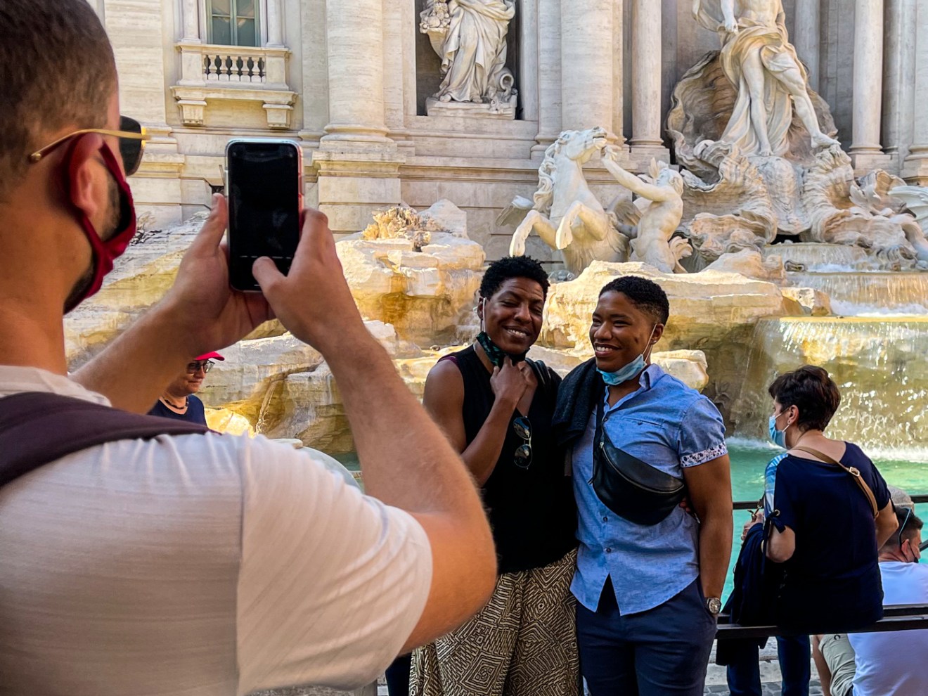 a group of people standing in front of a building
