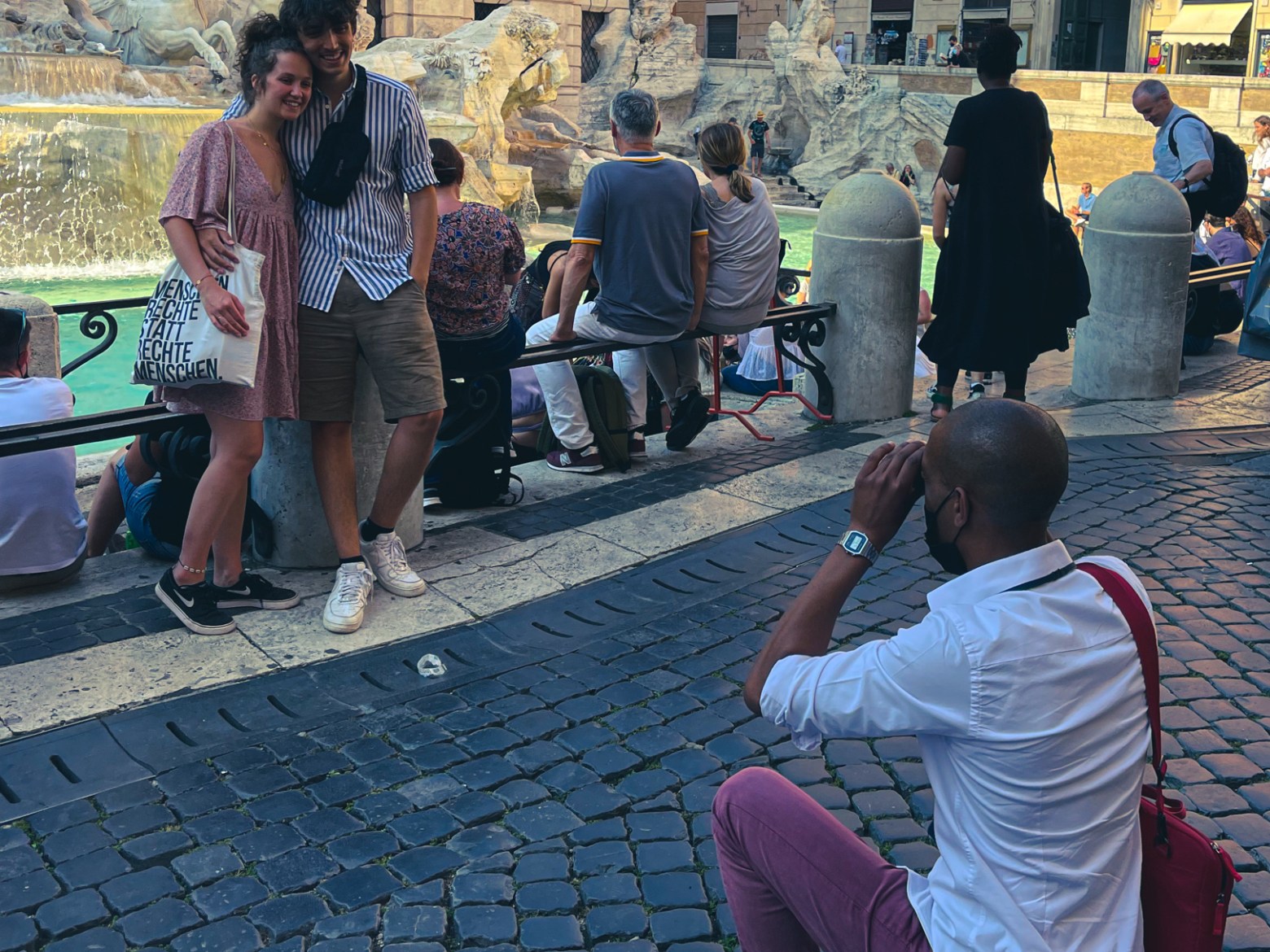 a group of people on a sidewalk