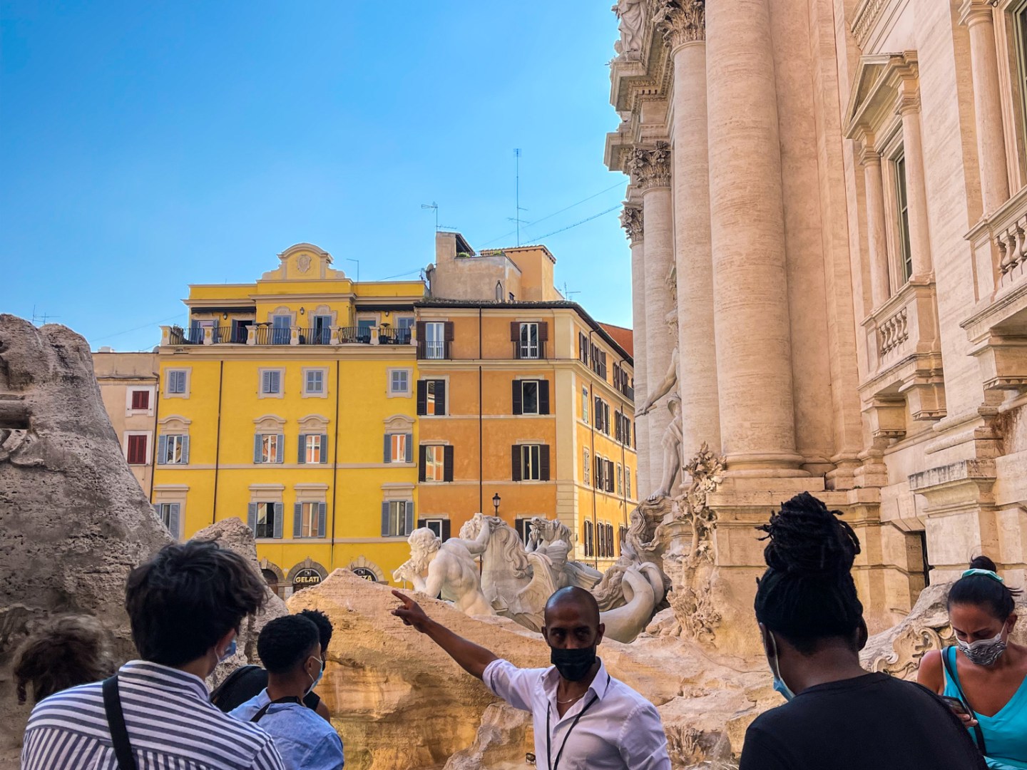 a group of people standing in front of a building