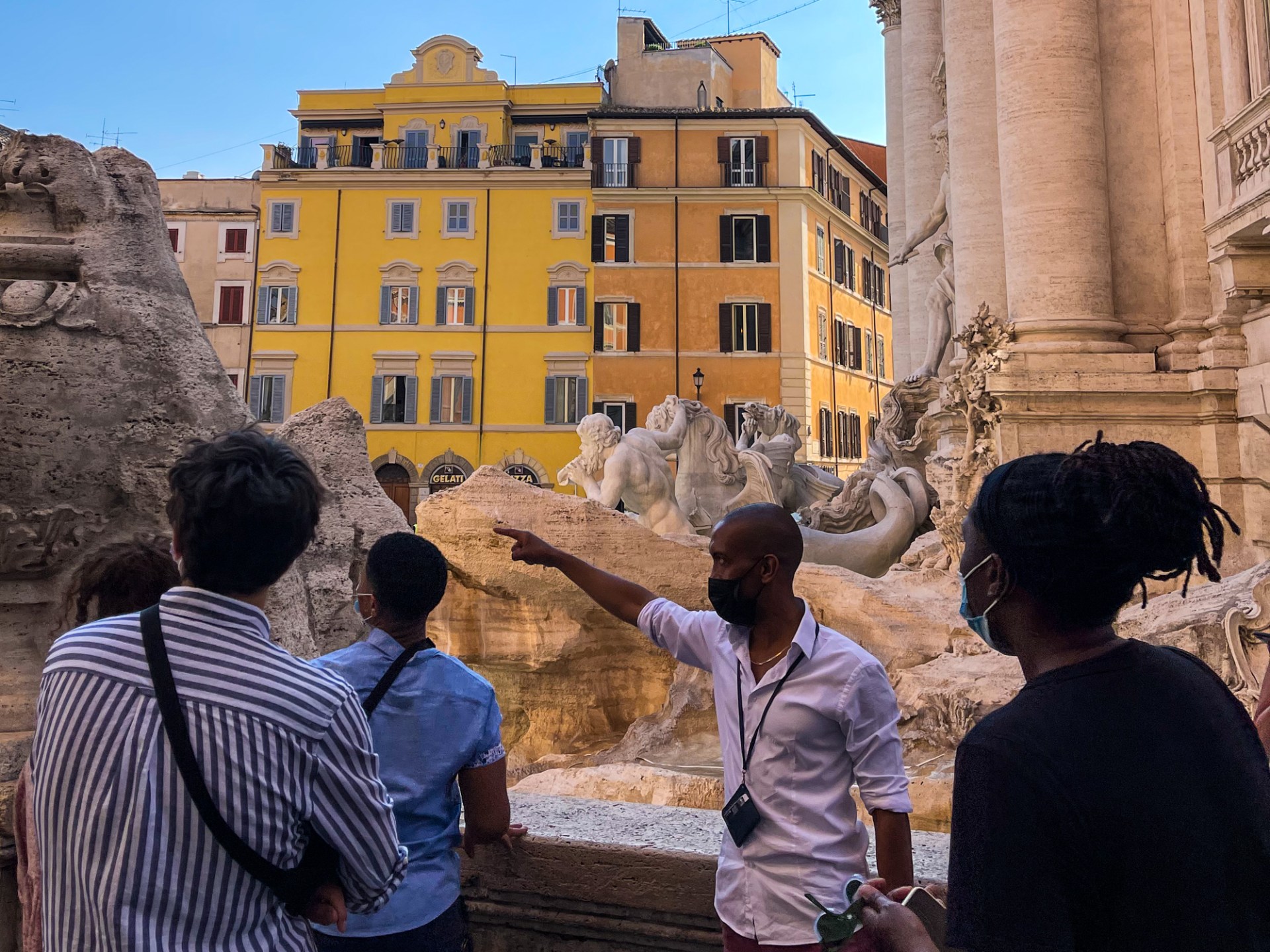 a group of people standing in front of a building