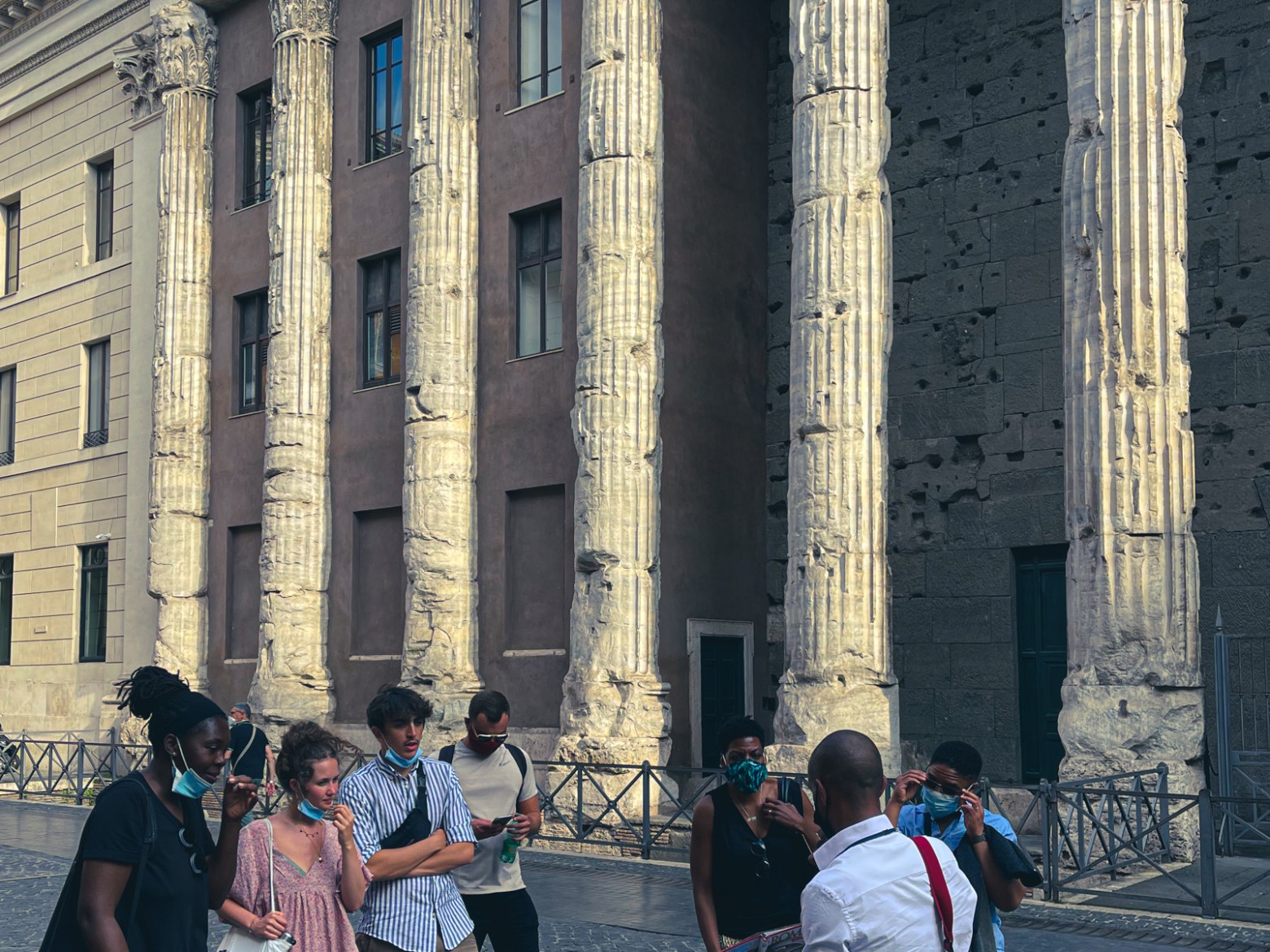 a group of people standing in front of a building