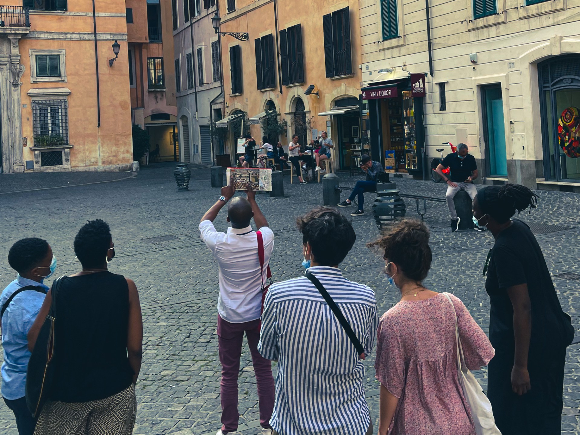 a group of people walking down a street