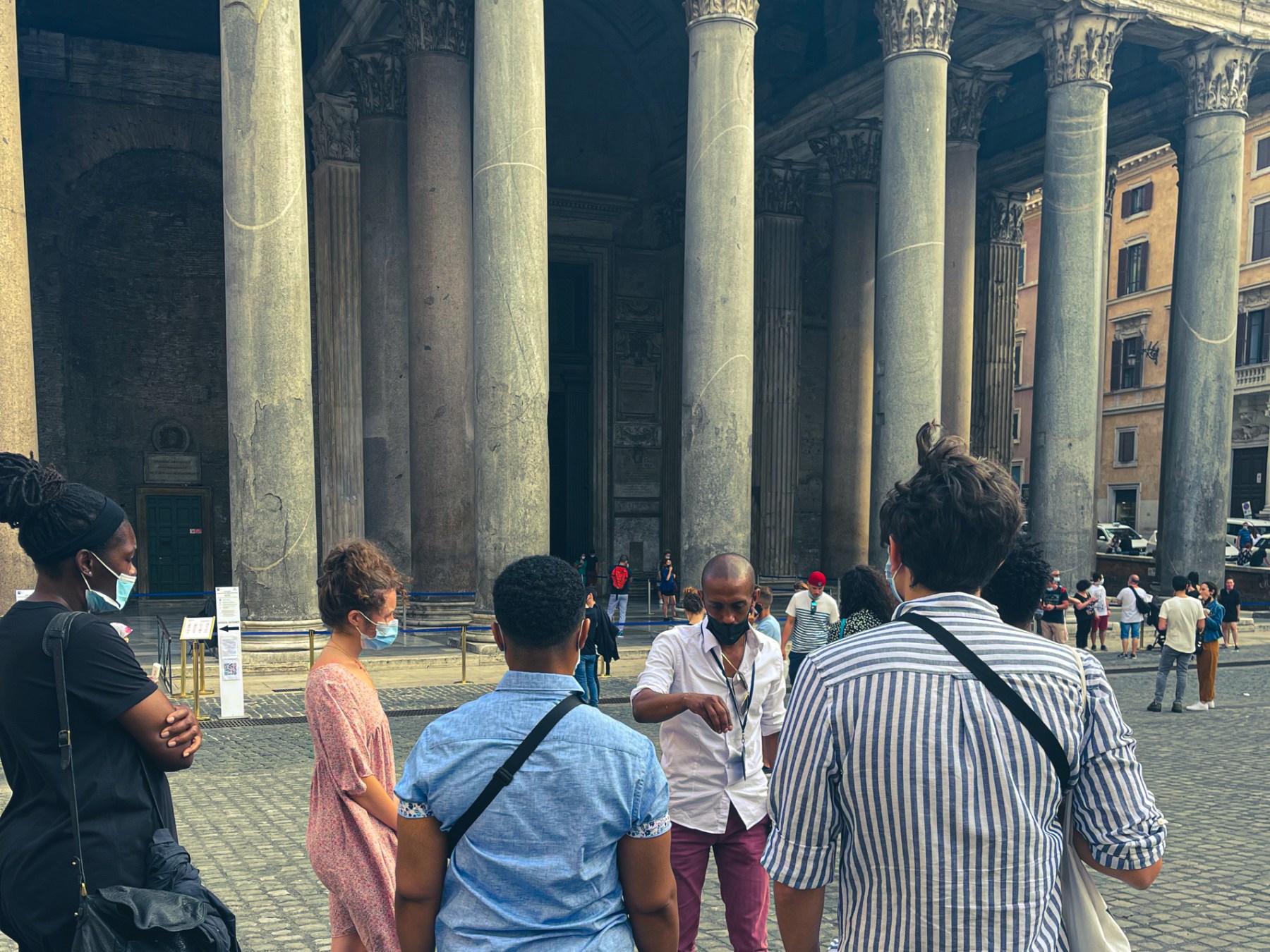 a group of people standing in front of a building