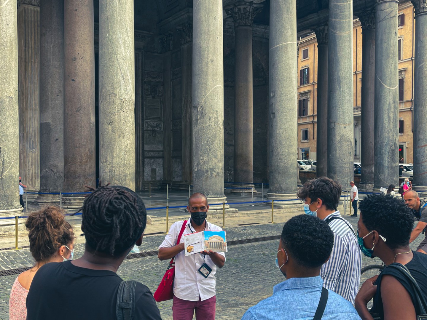 a group of people standing in front of a building