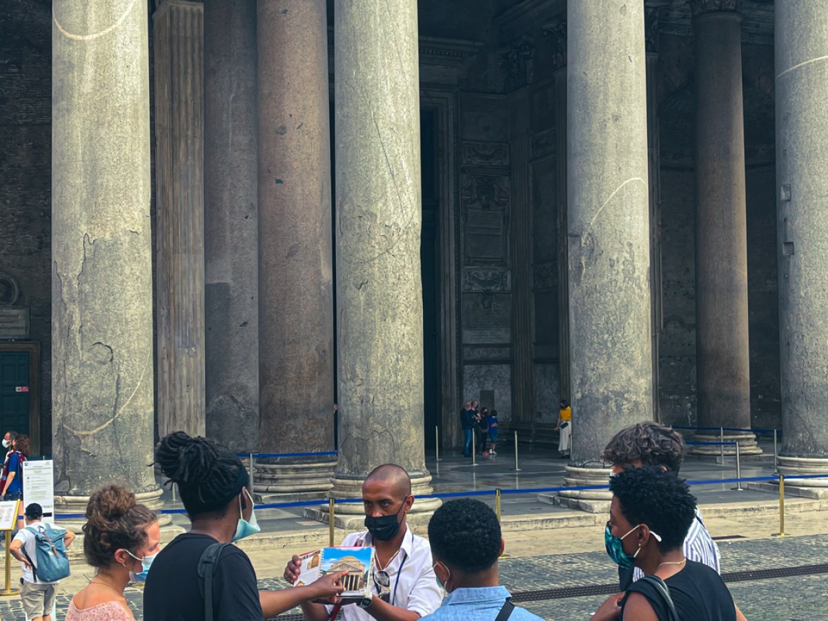 a group of people standing in front of a building