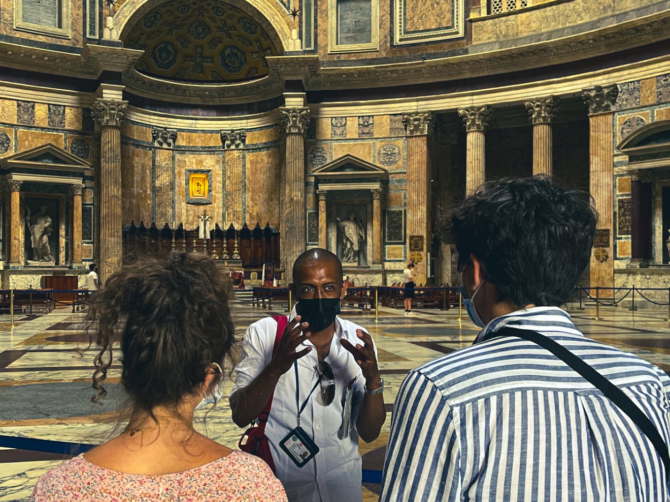 a group of people standing in front of a building