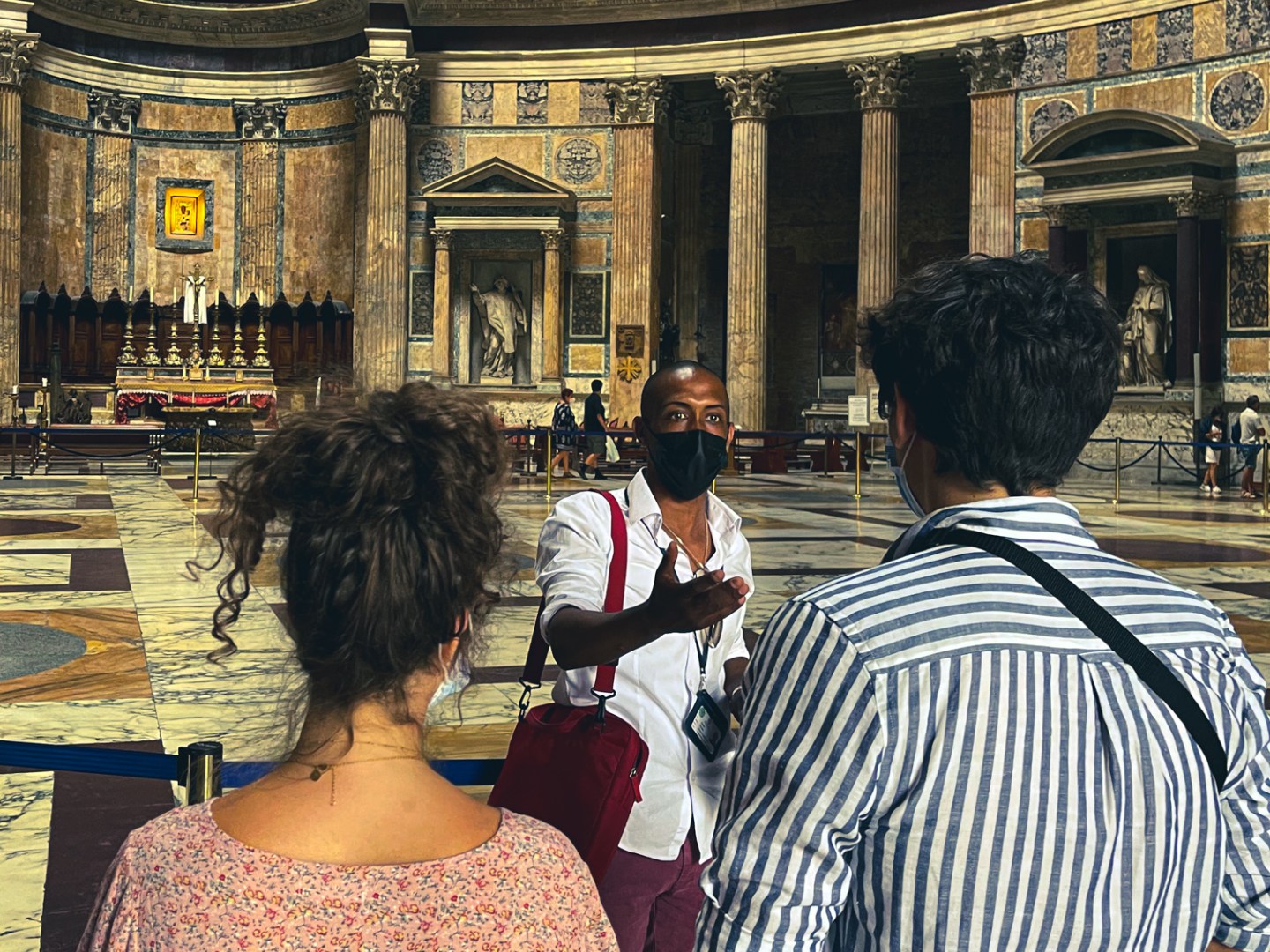 a group of people standing in front of a building