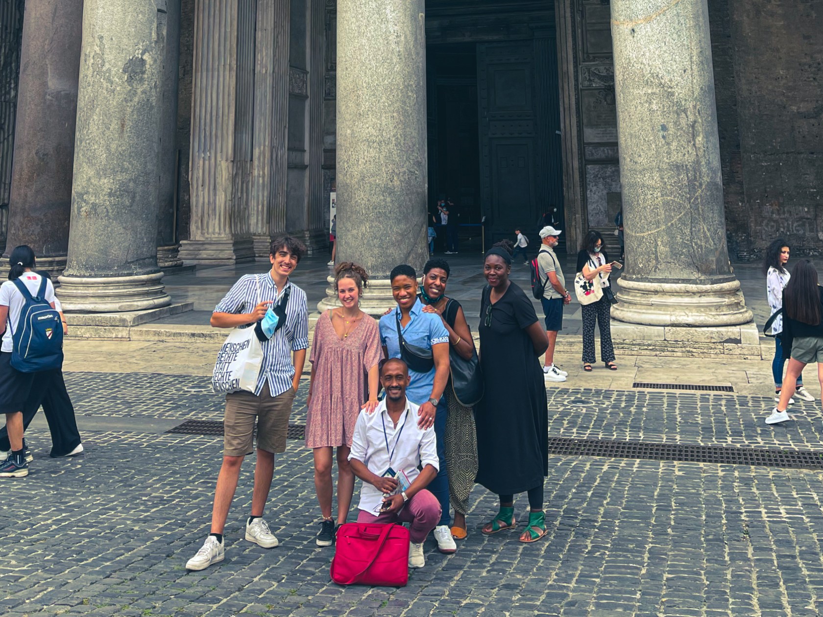 a group of people on a sidewalk