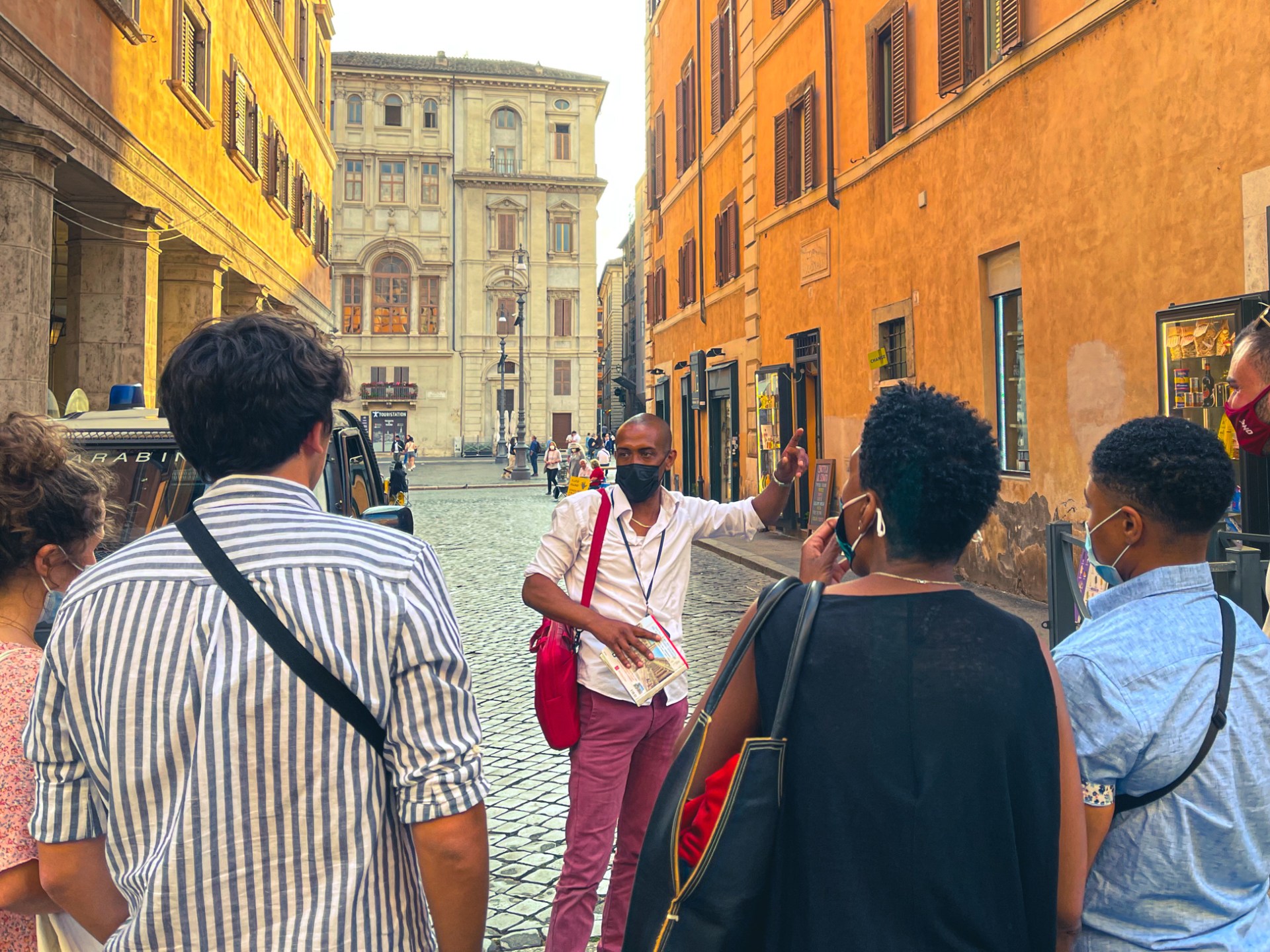 a group of people standing in front of a building