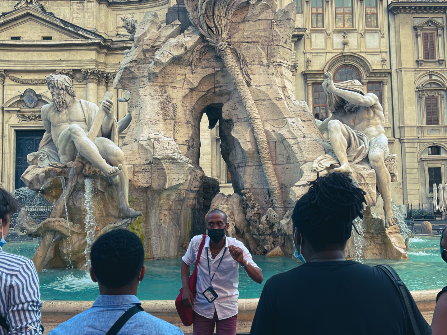 a group of people standing in front of a building